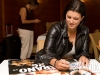 Gina signing posters